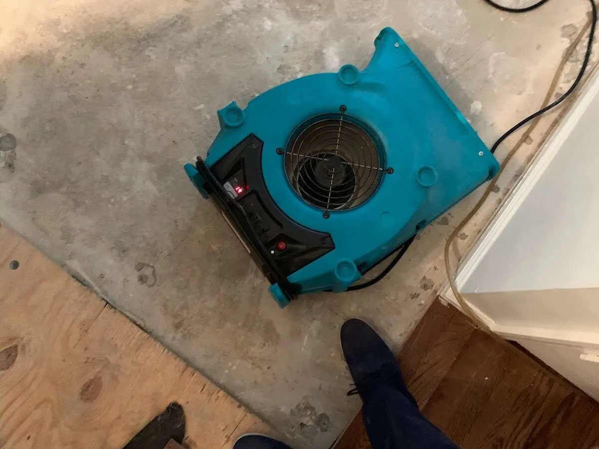 Air mover drying subfloor during Commercial Water Damage Restoration in Indian Trail